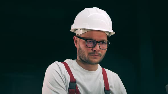 Engineer Keeping an Eye on Metal Working Process