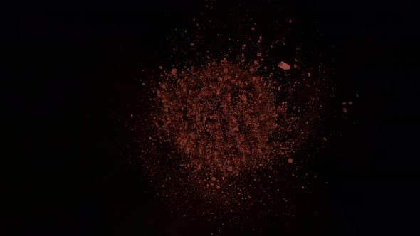 Super Slow Motion Shot of Rotating Cocoa Powder Explosion Towards Camera at 1000Fps