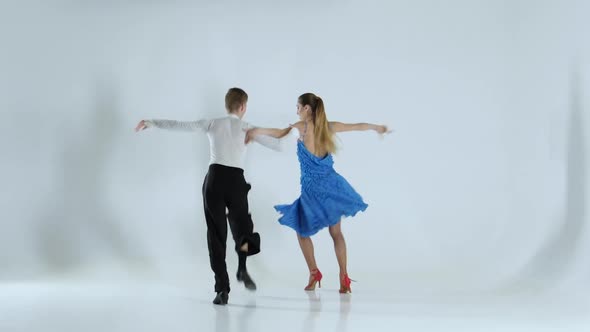 Couple of Graceful Dancers Perform Ballroom on White Background, Shadow