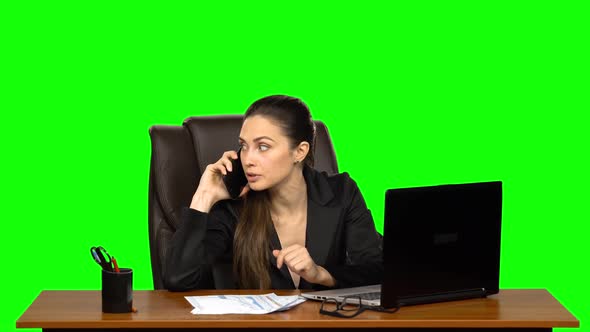 Girl Working on a Laptop Then Answers the Call By Mobile Phone and Very Angry. Green Screen