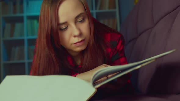 A Beautiful Student Reading a Big Book