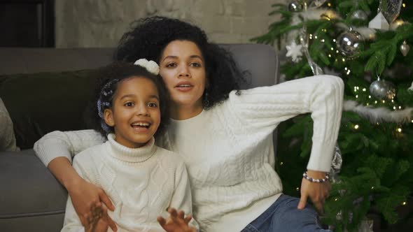 Portrait of African American Mom and Her Little Daughter with Shocked and Surprised Wow Face