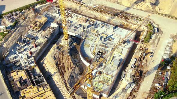 High building construction site. Big industrial tower crane with blue sky amd cityscape on backgroun