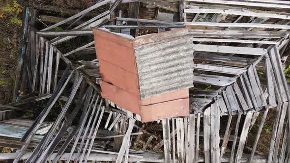 Abandoned Rural House with Collapsed Roof Aerial View