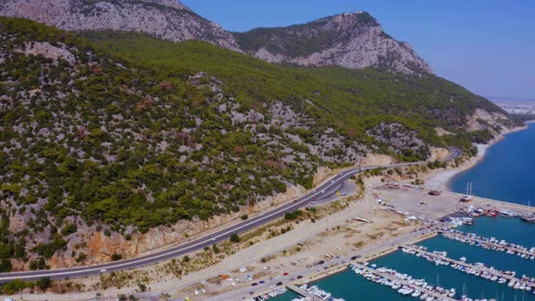 Aerial View of Mountain Road Near the Coastline Sea Port