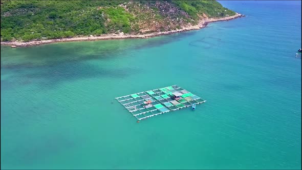 Drone Approaches Floating on Sea Lobster Farm By Coast