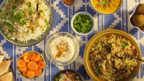 Eating Bulgur with Eggplant and Couscous with Chicken Top View