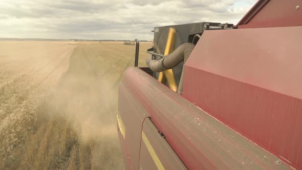 Large Combine Header Mows the Wheat