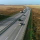 Trucks and Cars Drive Along the Highway - VideoHive Item for Sale