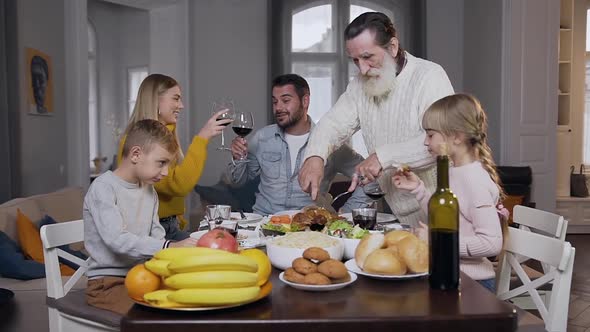 Pleasant Happy Smiling People During Festive Family Dinner on Thanksgiving Day