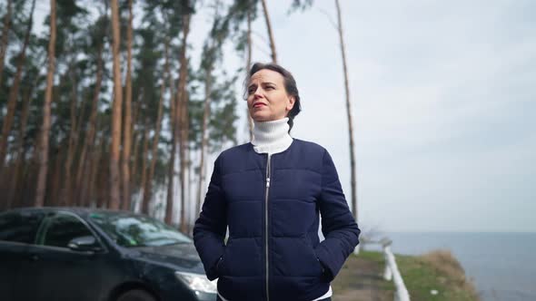 Beautiful Slim Caucasian Woman Walking in Slow Motion on River Bank Smiling Enjoying Weekend