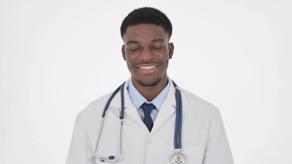 African Doctor Shaking Head As Yes Sign on White Background