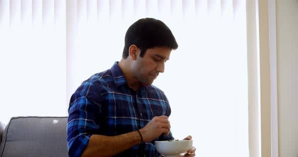 Man having breakfast at home 4k