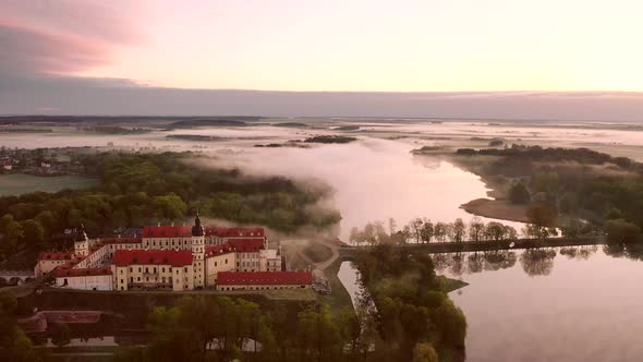 Amazing Dawn in the Foggy Nesvizh, Fog Over the River. Nesvizh. Ancient Castle . Belarus