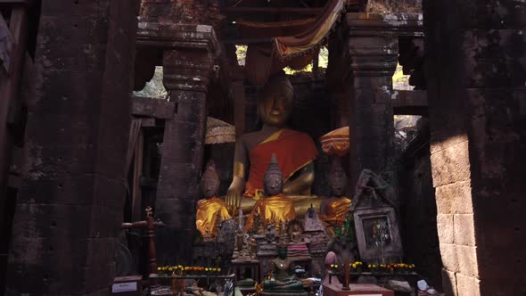 Vat Phou ruined Khmer Hindu Mountain Temple. Buddhism, Buddhist altar, buddha statues. Laos. Slow