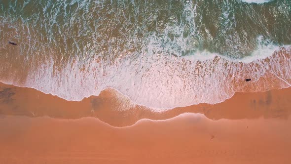 Aerial topdown view along sand beach shore, Natal