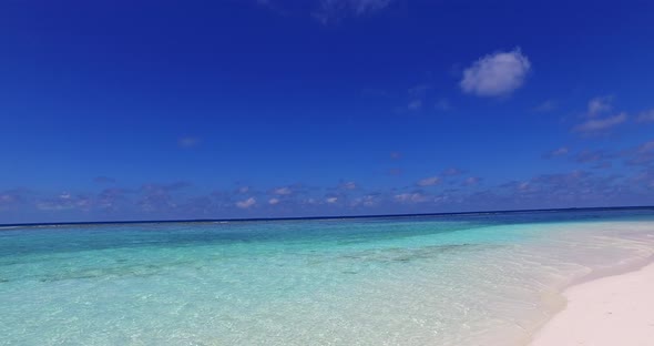 Wide angle above tourism shot of a sandy white paradise beach and turquoise sea background in hi res