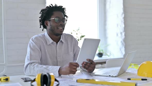 Video Chat on Tablet By African Engineer