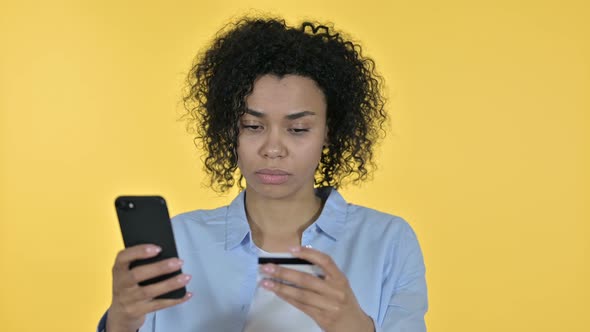 Portrait of Casual African Woman Making Online Payment on Smartphone