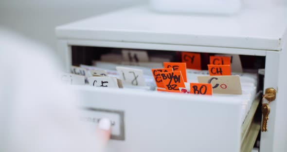 Female Doctor Looks for Personal Data in the File