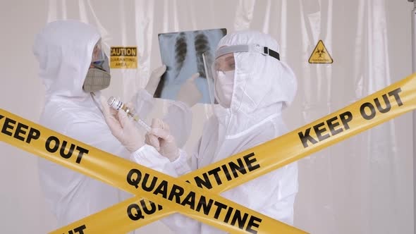 Medical Doctor with Protective Suit Checking Examining Chest Xray Film