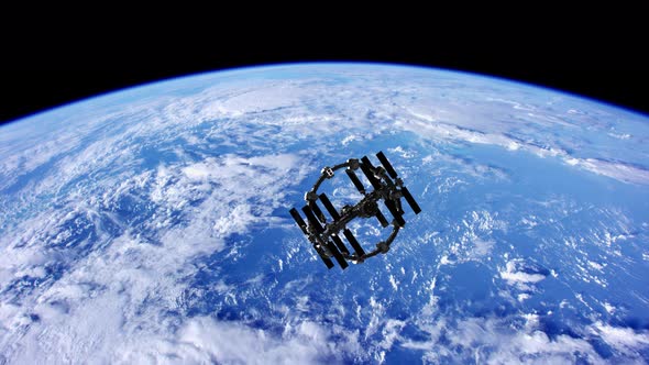 International Space Station in Outer Space Over the Planet Earth alt