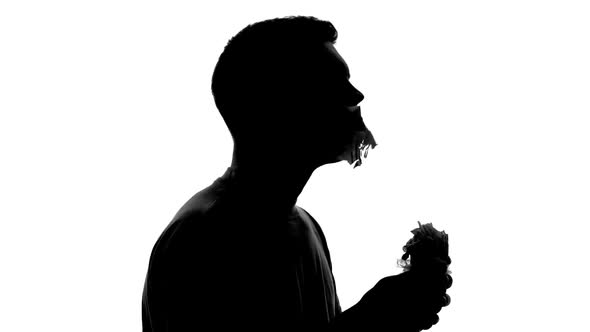 Hungry Man Silhouette With Huge Appetite Biting and Chewing Greasy Fast Food