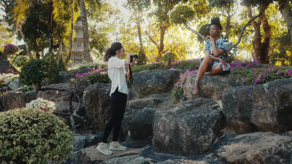 A Beautiful Black Model Poses for a Photographer