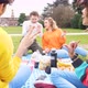 Four multiethnic friends outdoor using smartphone - VideoHive Item for Sale