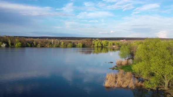 Aerial drone view over river in countryside