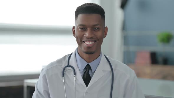 Portrait of African Doctor Shaking Head as Yes Sign, Approval