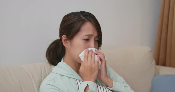 Woman feel sick and sneeze at home