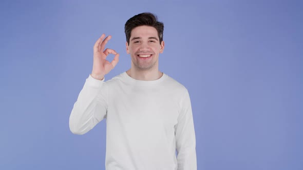 Handsome Man in White Wear Shows Okay Ok Gesture