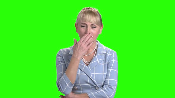 Mature Woman Is Yawning on Chroma Key Background