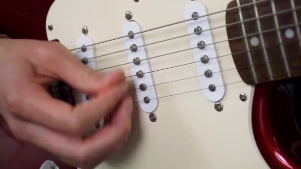 Funky strumming on electric stratocaster guitar