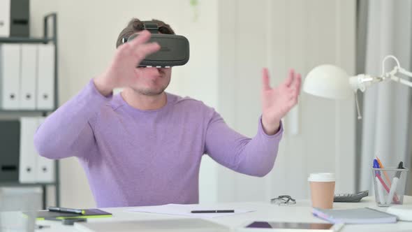 Middle Aged Man Wearing VR Headset in Office 