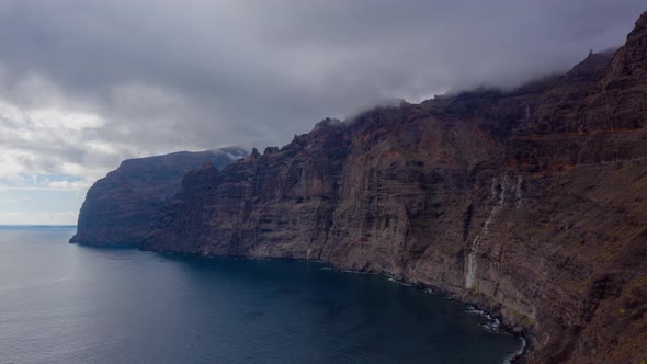 Aerial Hyperlapse of Los Gigantes Cliffs on Tenerife Overcast Canary Islands Spain