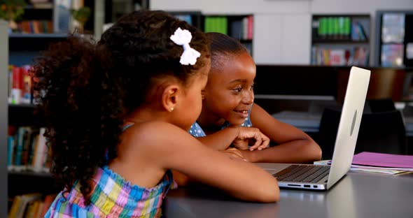 Schoolgirls using laptop 4k