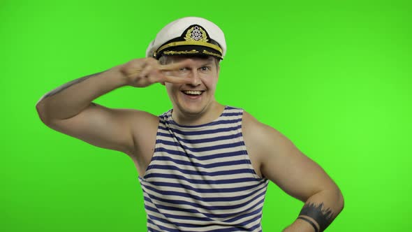 Young Sailor Man Dances and Celebrates. Seaman Guy in Sailor's Vest. Chroma Key