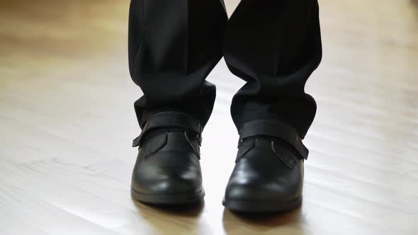 Man in Black Shoes and Trousers is Making Steps Forward and Going Away