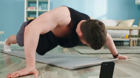 Strong Man Is Doing Intese Workout at Home