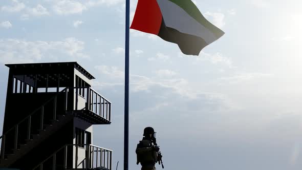 Soldier on Watch Under the Flag of the United Arab Emirates