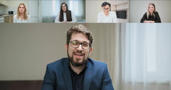 Bearded Chairman in Glasses and Suit Talks to Managers