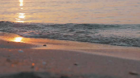 Sea Waves Rolling on the Shore at Sunset