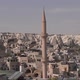 High Minaret of Mosque with Sharp Spire By Stone Buildings - VideoHive Item for Sale