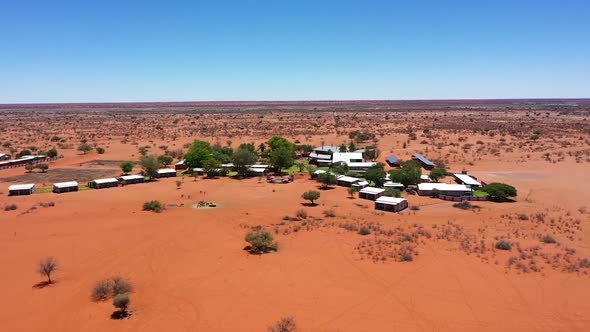 Super wide drone shot of a lodge in the desert of Namibia, Africa. From far away to near.