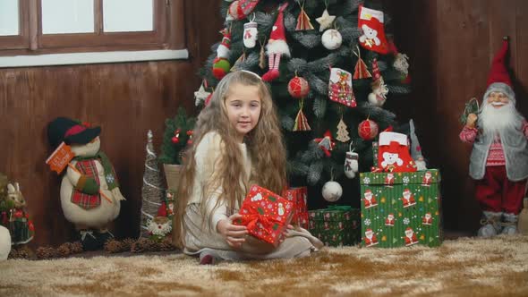 Girl with a Gift Box in Her Hands