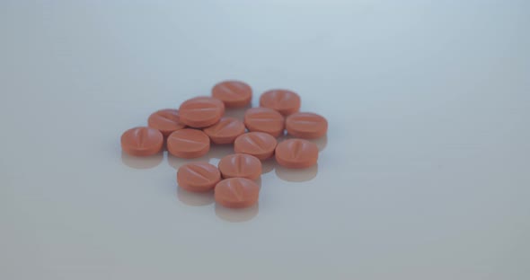 Prescription drugs - Capsules, pills, tablets on reflective background