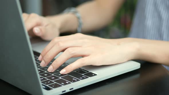 Businesswoman using a laptop computer.