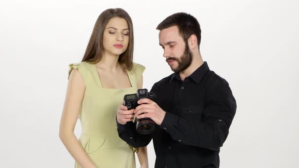 Photographer and Girl Are Viewing the Outcome of Photography. White
